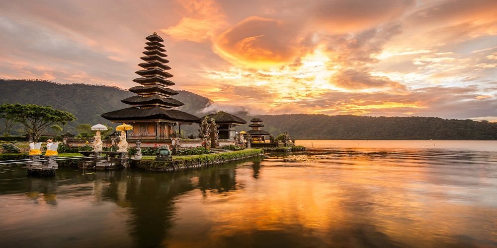 Bali — a temple reflected in a lake at sunrise