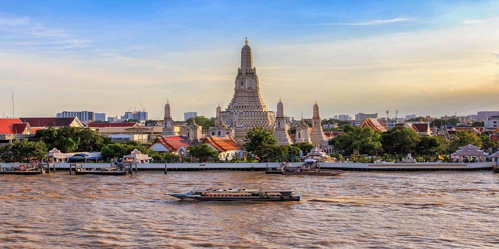 Thailand — a temple and river skyline at dusk